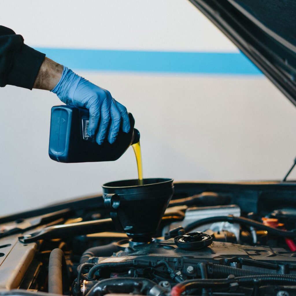 adding oil to a vehicle